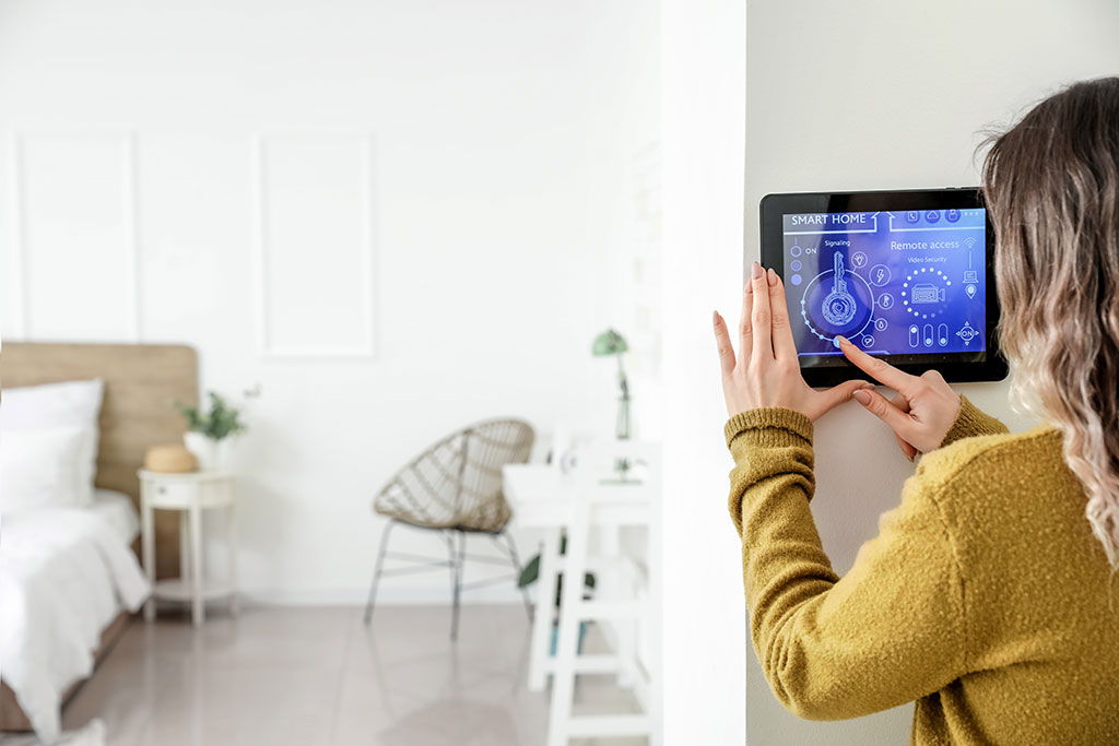 Woman adjusting Smart Home screen